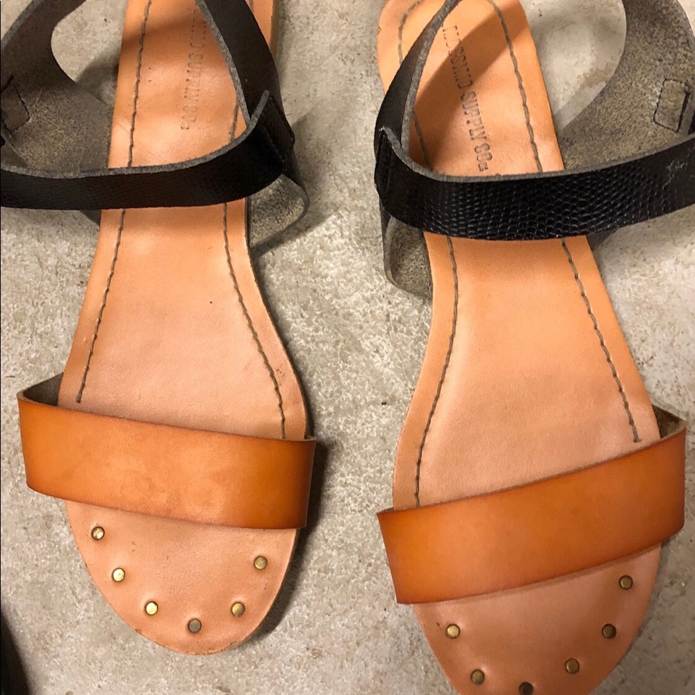 Tan and black sandals